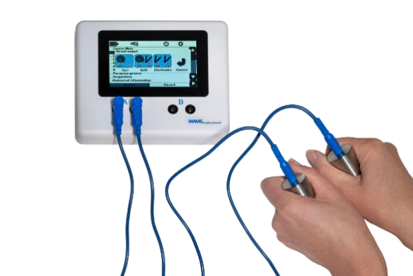 Person using a Rife machine during a frequency therapy session